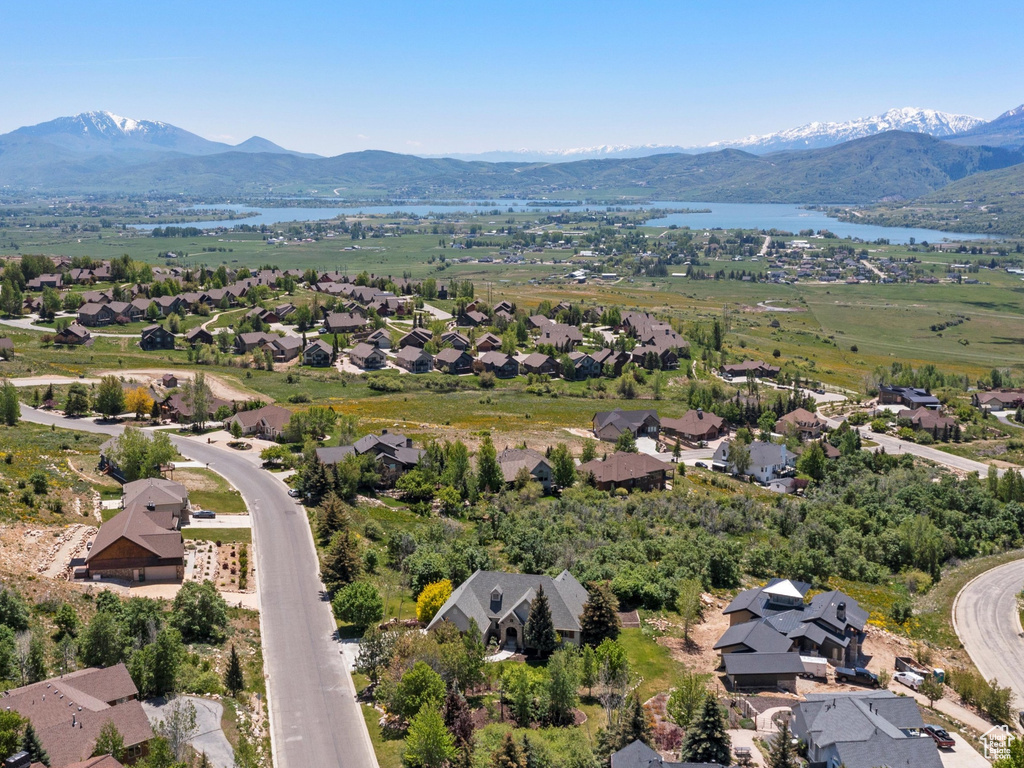 Aerial perspective of suburban area with a water and mountain view