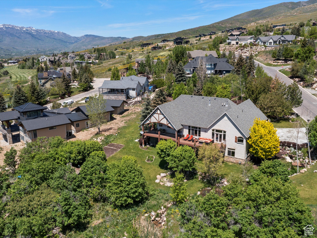 Aerial view of residential area featuring mountains
