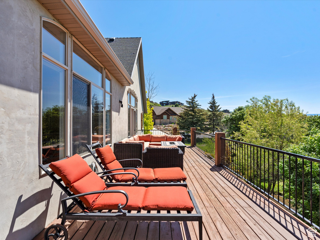 Wooden deck with an outdoor living space