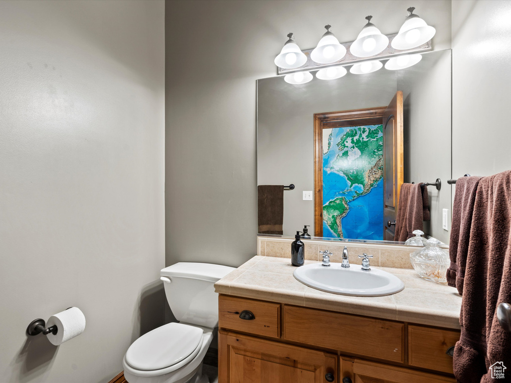 Bathroom featuring toilet and vanity