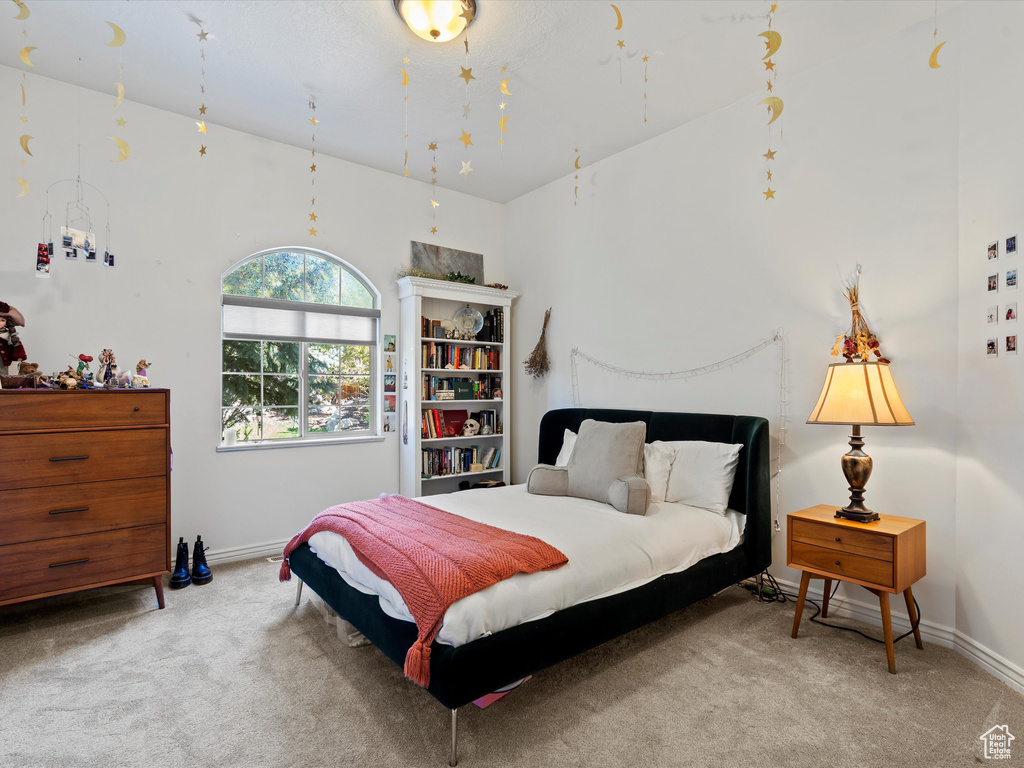 Carpeted bedroom with baseboards