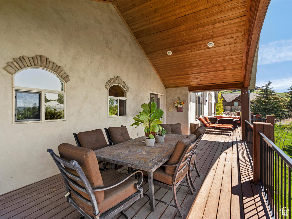 Deck featuring an outdoor living space and outdoor dining space