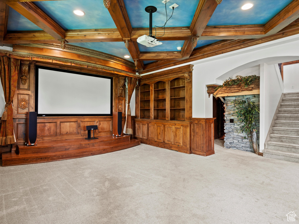 Cinema room featuring coffered ceiling, carpet floors, beam ceiling, ornamental molding, and recessed lighting