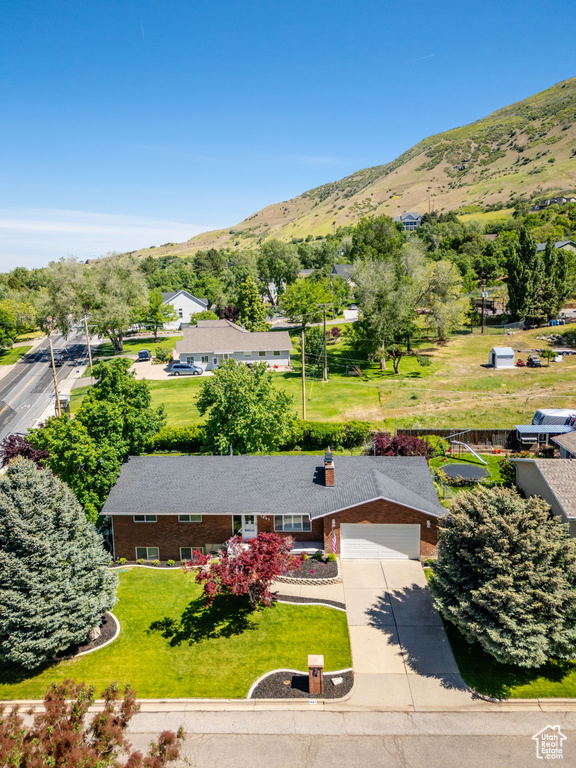 View of subject property with a mountain backdrop