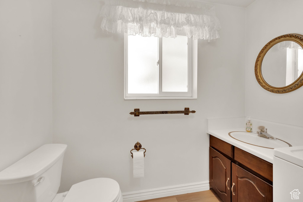 Bathroom featuring toilet and vanity