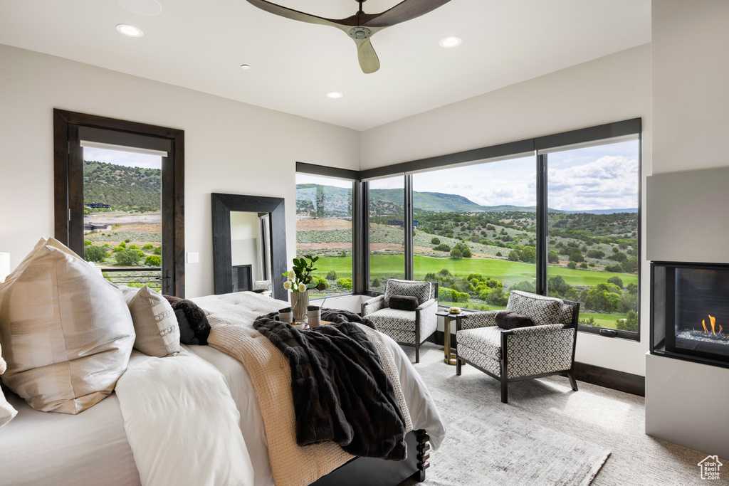 Bedroom with recessed lighting, ceiling fan, and a mountain view