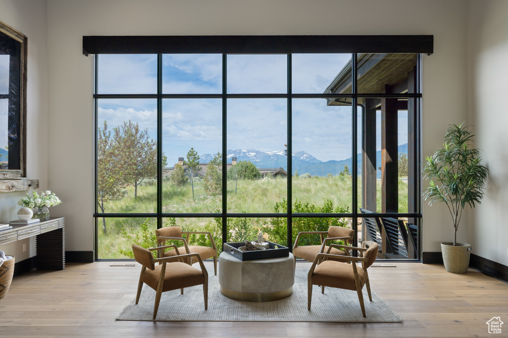 Sunroom with a mountain view