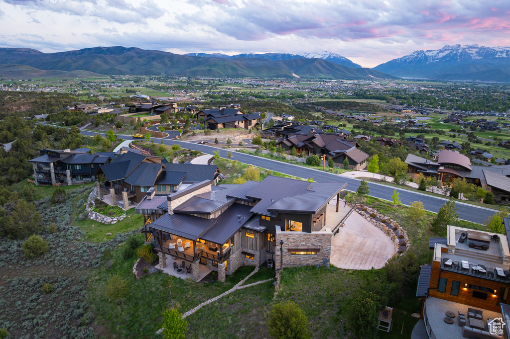 Aerial view of residential area featuring a mountain backdrop