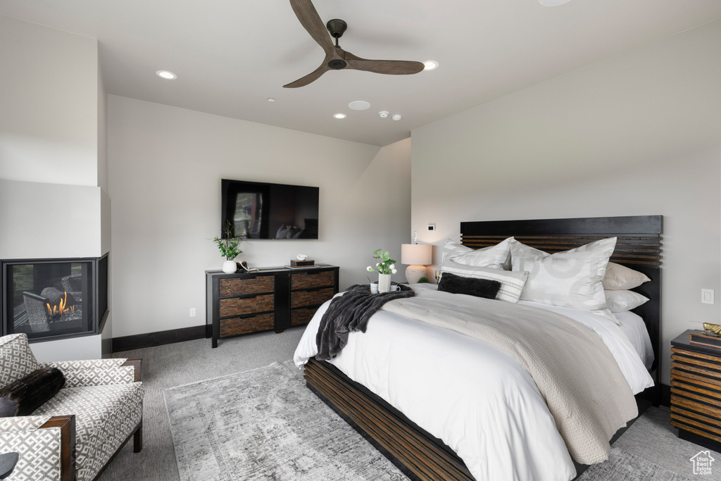Carpeted bedroom with recessed lighting, a ceiling fan, and baseboards