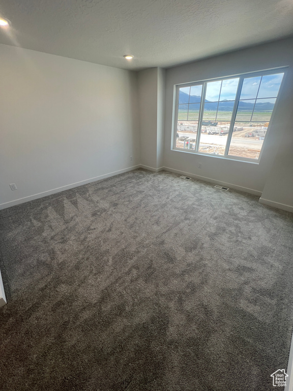 Empty room with baseboards, carpet flooring, and recessed lighting