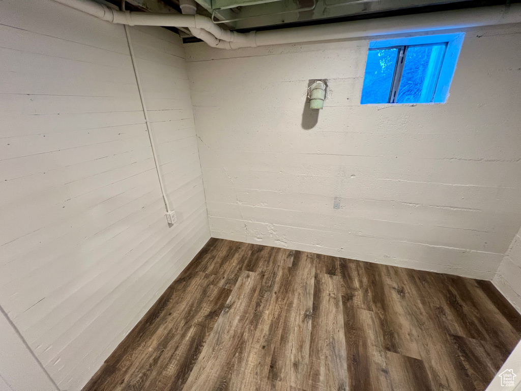 Below grade area featuring dark wood-type flooring