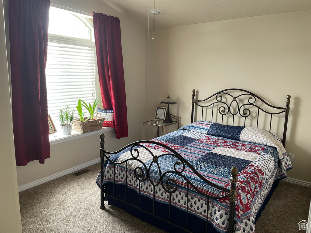 Carpeted bedroom with baseboards
