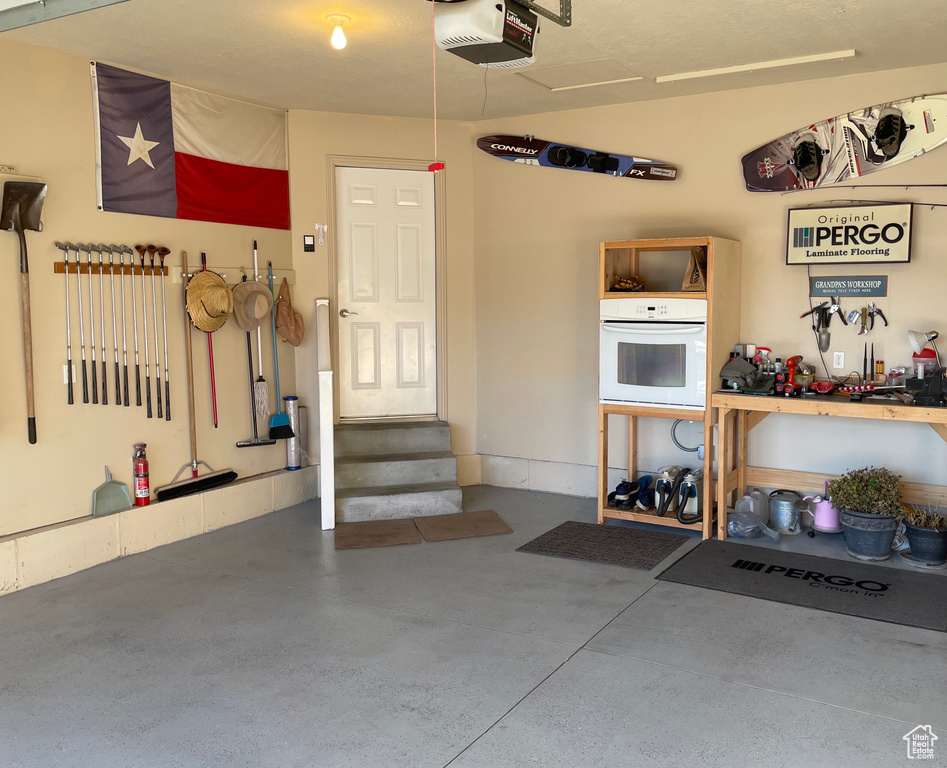 Garage featuring a garage door opener