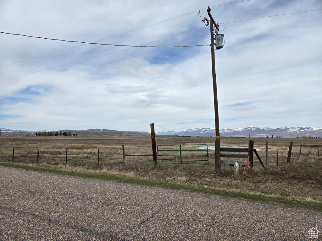 View of yard featuring a view of rural / pastoral area and a mountain view