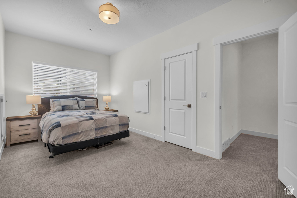 Bedroom with carpet and baseboards