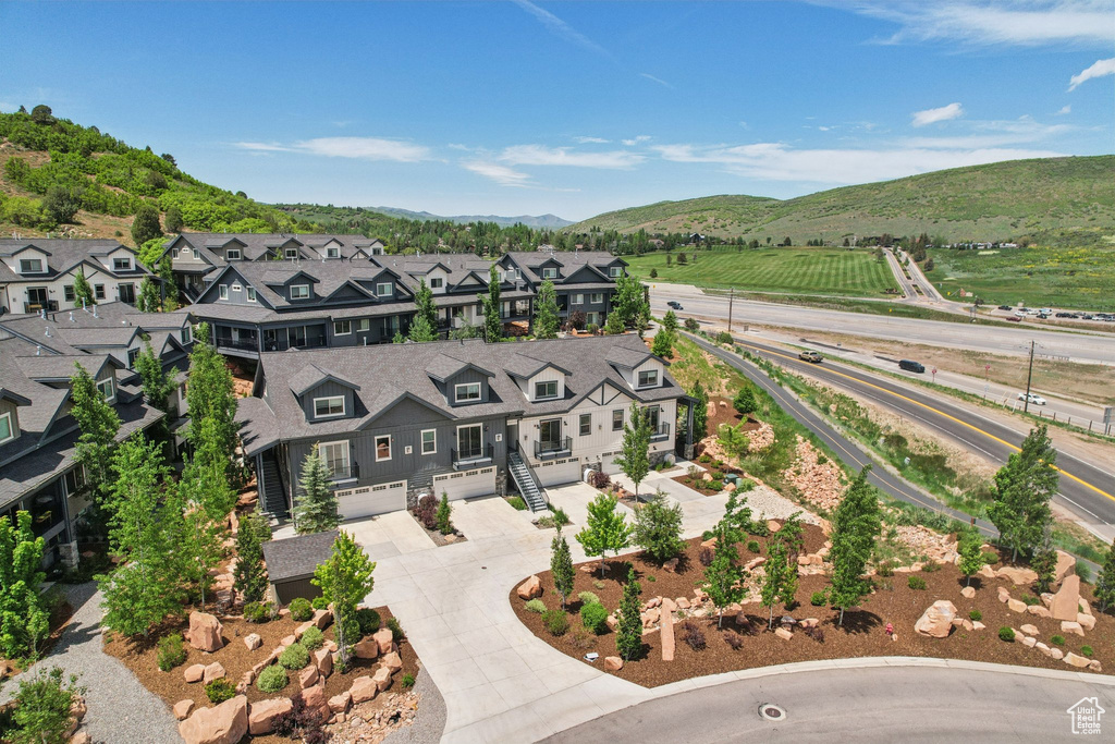 Aerial view of residential area featuring mountains