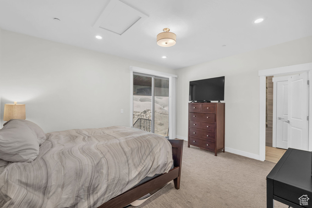 Bedroom with access to outside, attic access, recessed lighting, light carpet, and baseboards