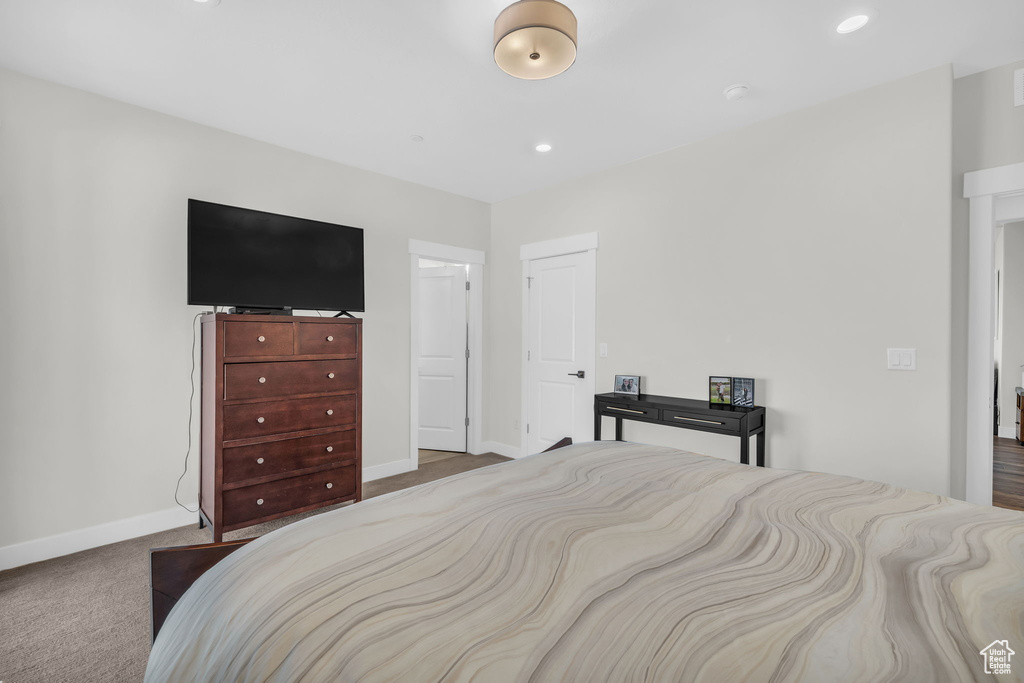 Bedroom with baseboards and carpet