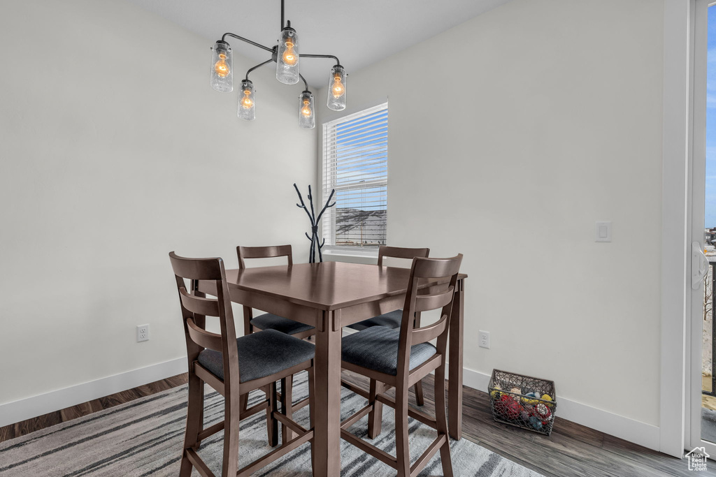 Dining area featuring baseboards and wood finished floors