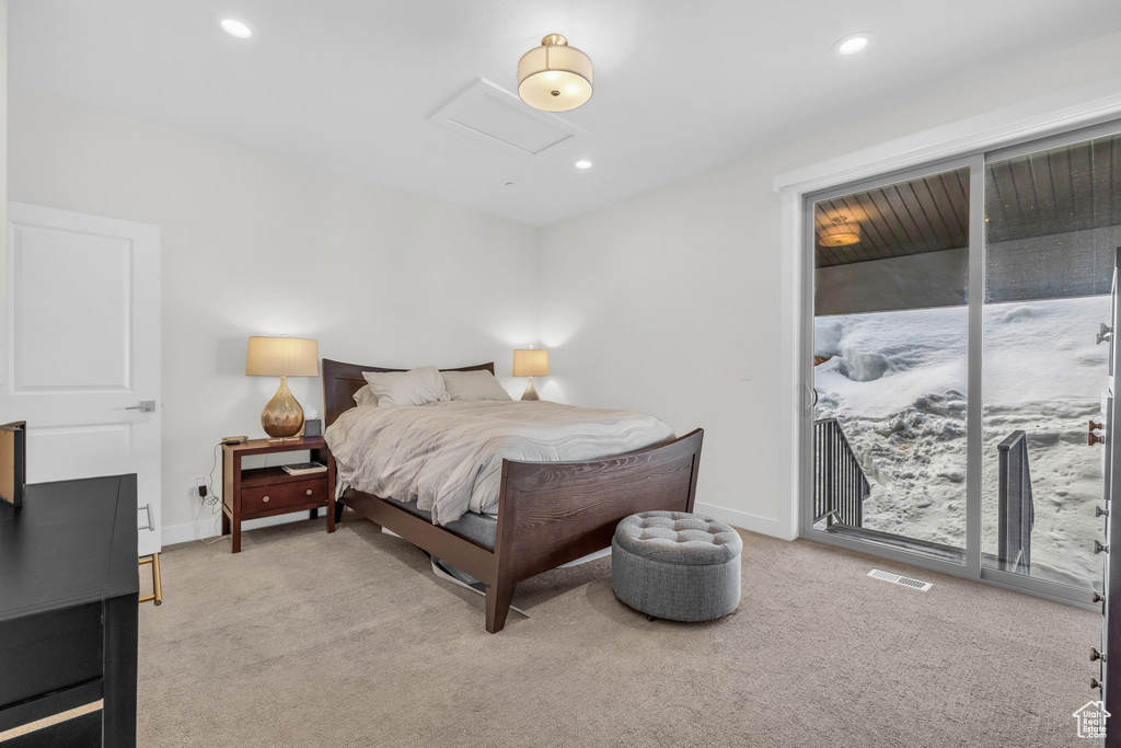 Carpeted bedroom with attic access, access to exterior, recessed lighting, and baseboards