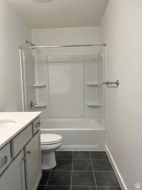 Full bathroom with vanity, shower / washtub combination, and tile patterned floors