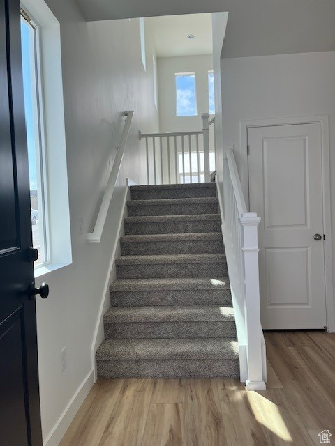 Stairway with wood finished floors