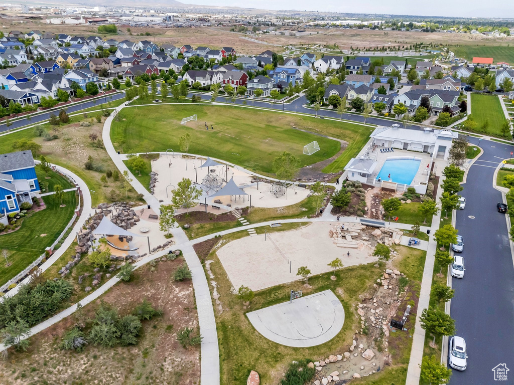 Aerial overview of property\'s location with nearby suburban area and a pool