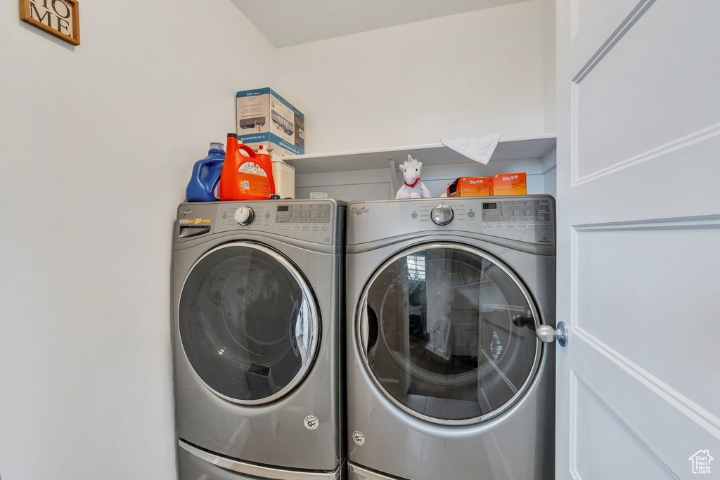 Laundry room featuring washing machine and clothes dryer