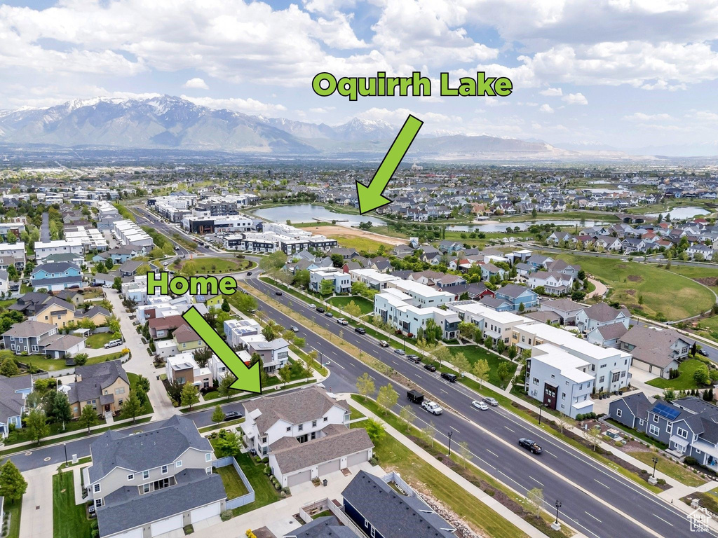 Aerial perspective of suburban area featuring a water and mountain view
