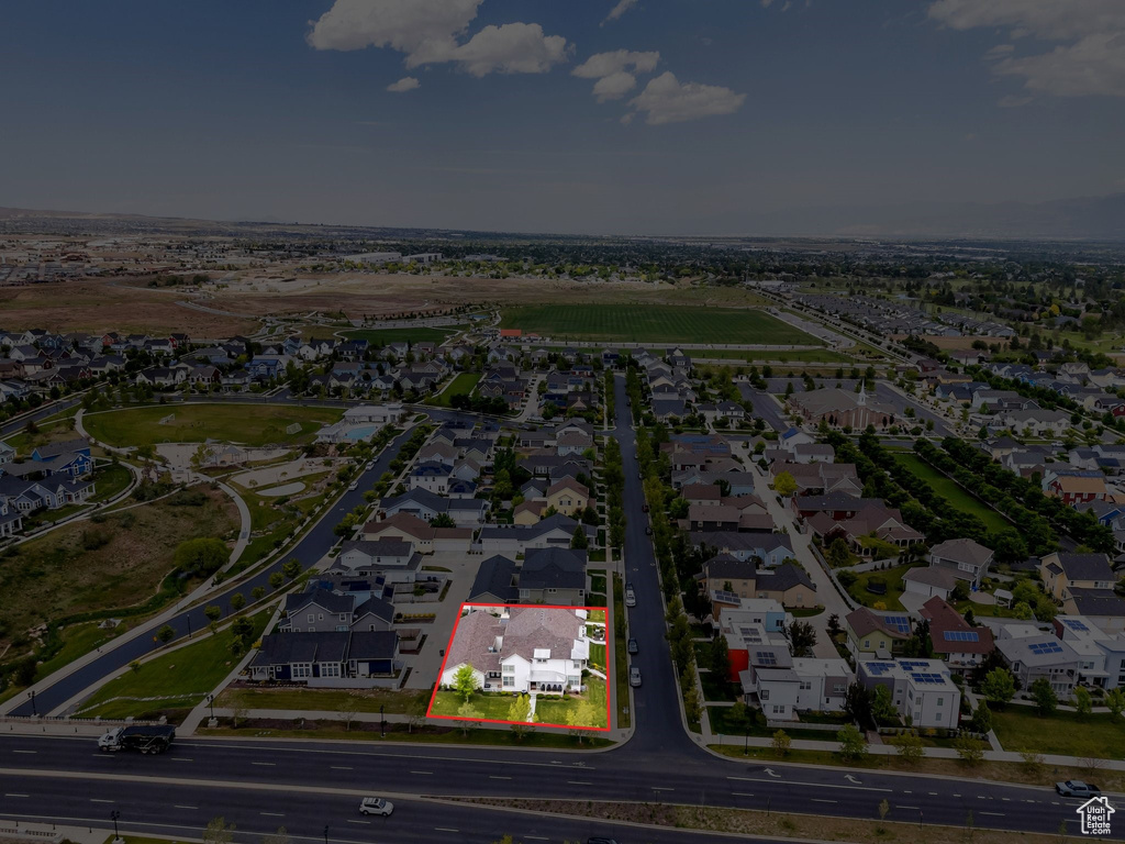 Aerial perspective of suburban area featuring property boundaries highlighted