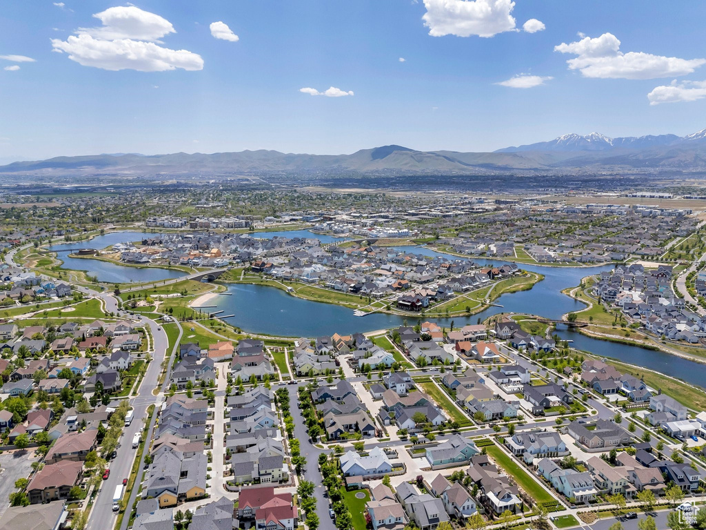 View of property location with nearby suburban area and a water and mountain view