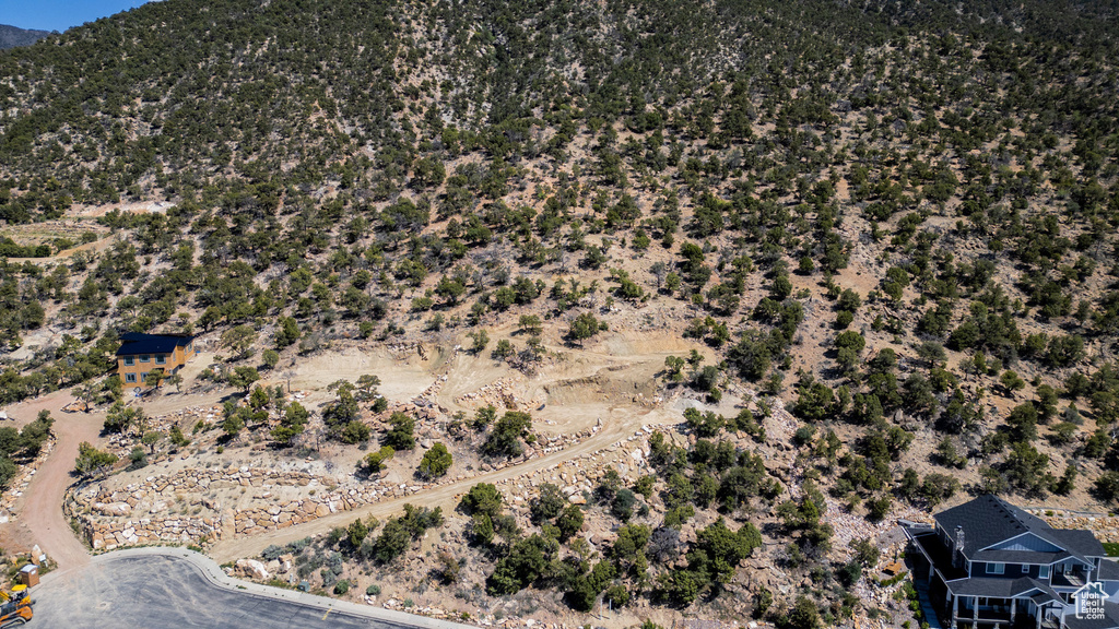 View of property location featuring mountains and a desert landscape
