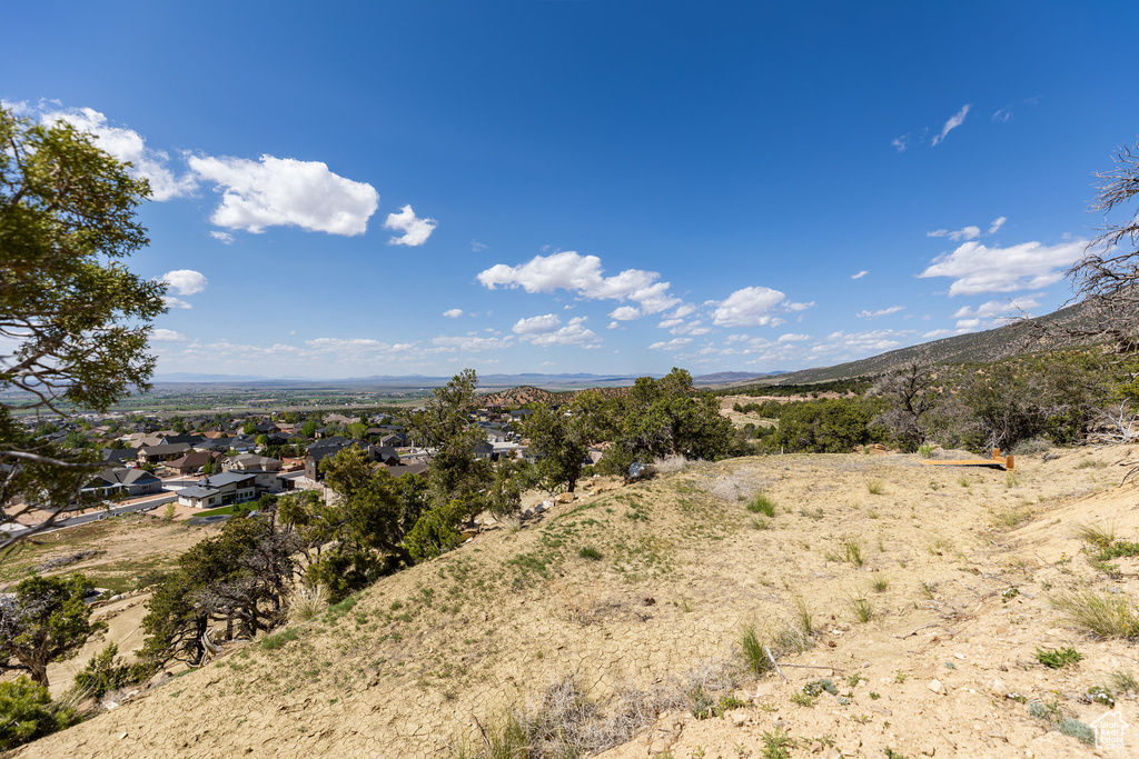 View of mountain backdrop featuring nearby suburban area