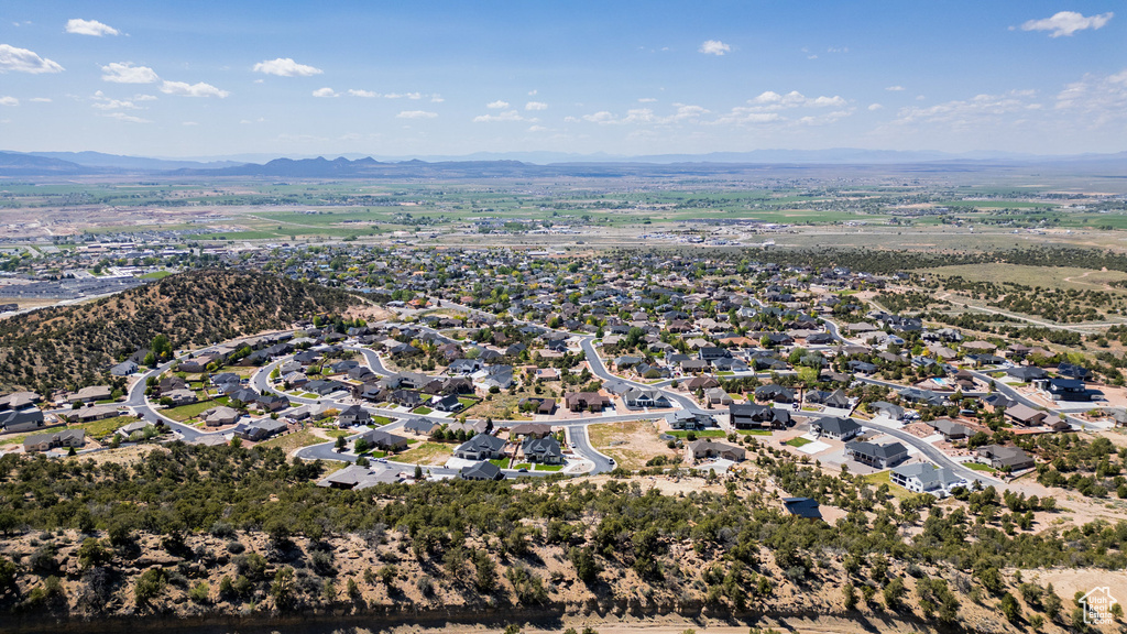Aerial view of property\'s location featuring mountains and nearby suburban area