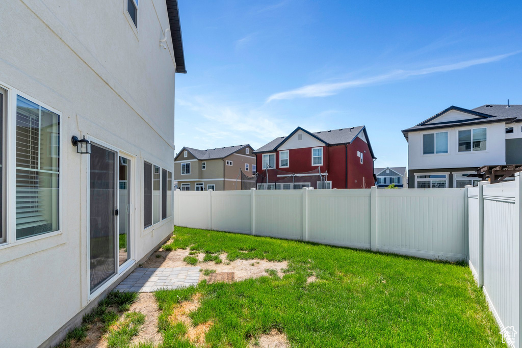 View of yard featuring a residential view and a patio