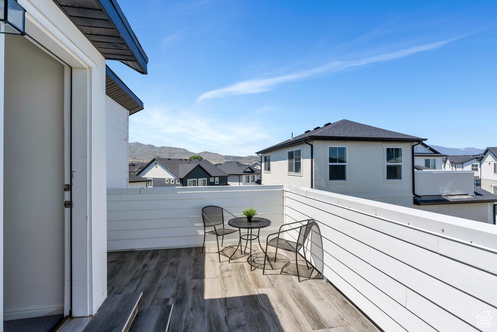 Deck with a mountain view and a residential view