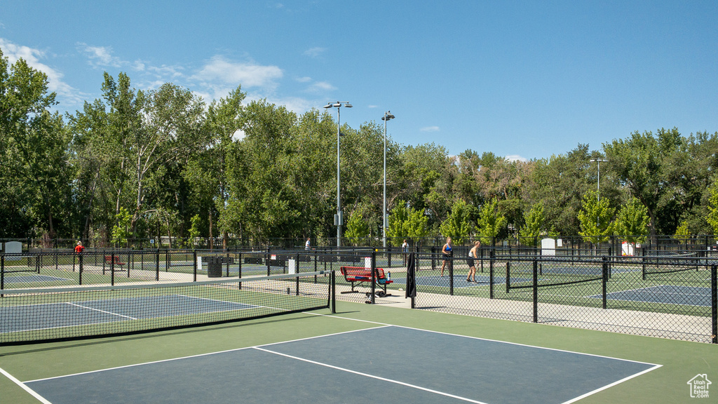 View of tennis court with community basketball court