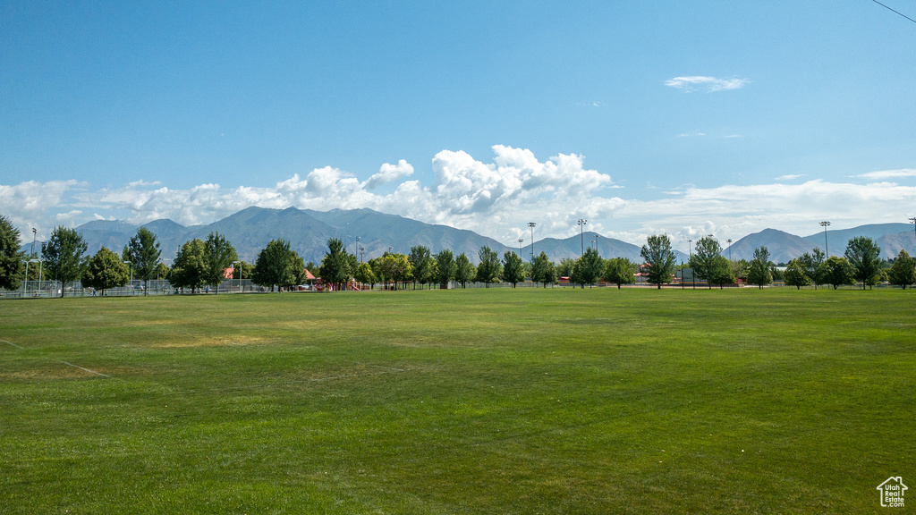 View of mountain backdrop with rural landscape