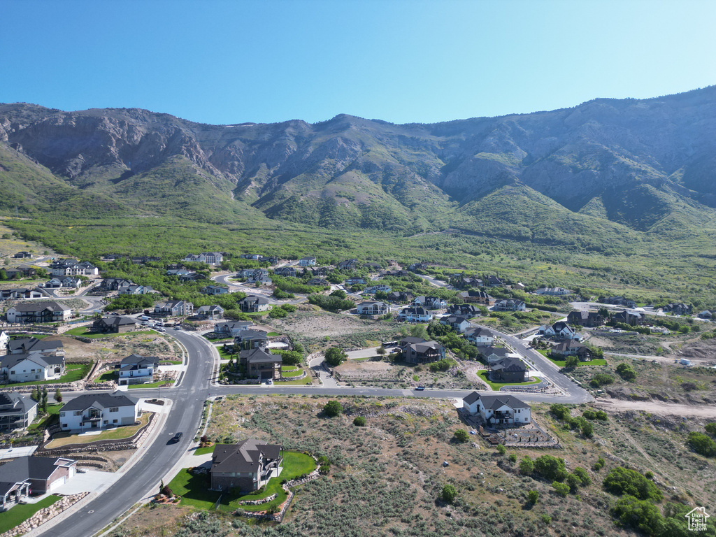 View of mountain backdrop featuring nearby suburban area