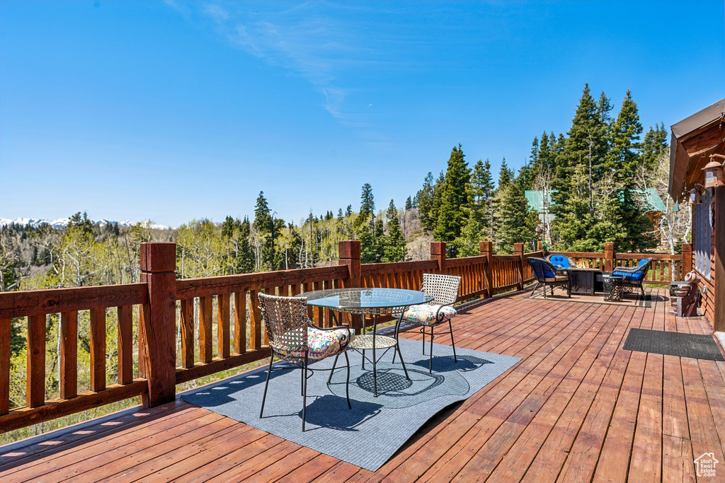 Wooden terrace featuring outdoor dining space
