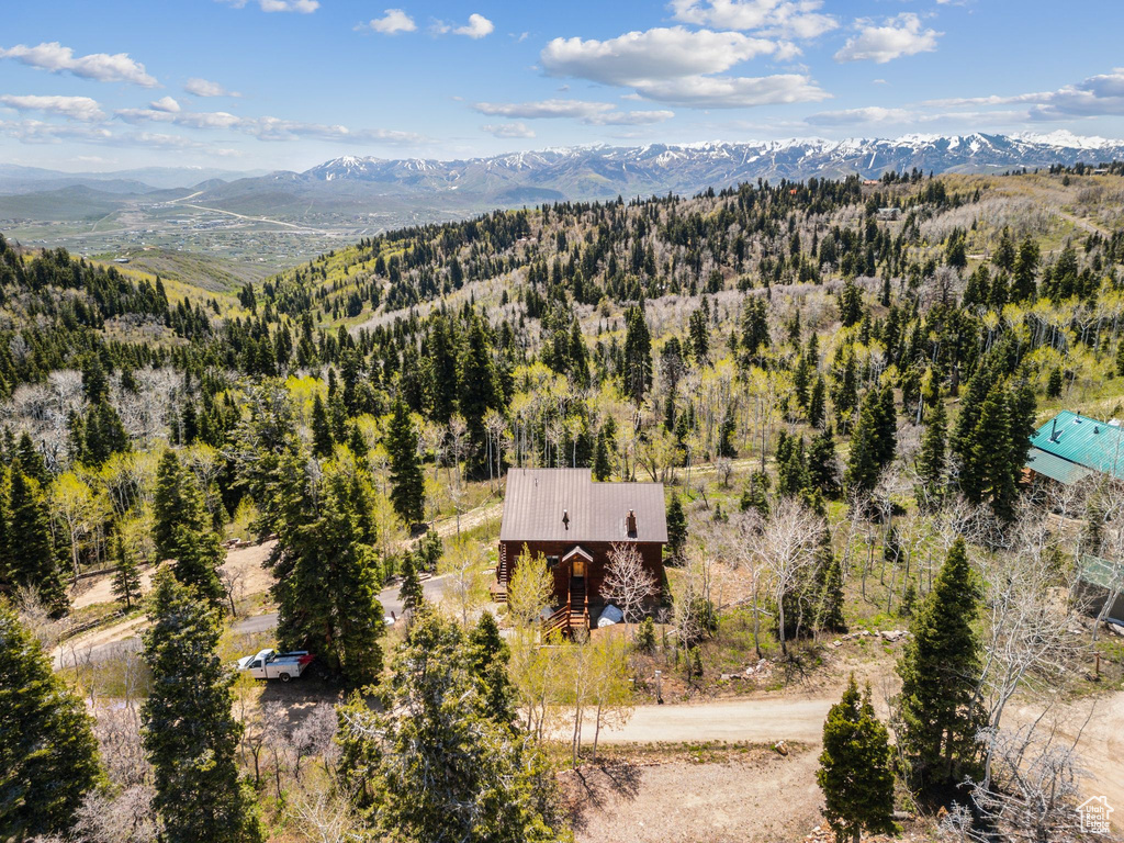 View from above of property with a mountain backdrop
