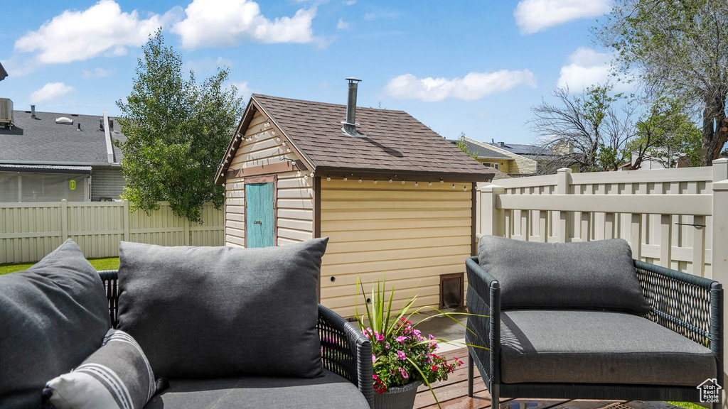 Exterior space featuring a shingled roof