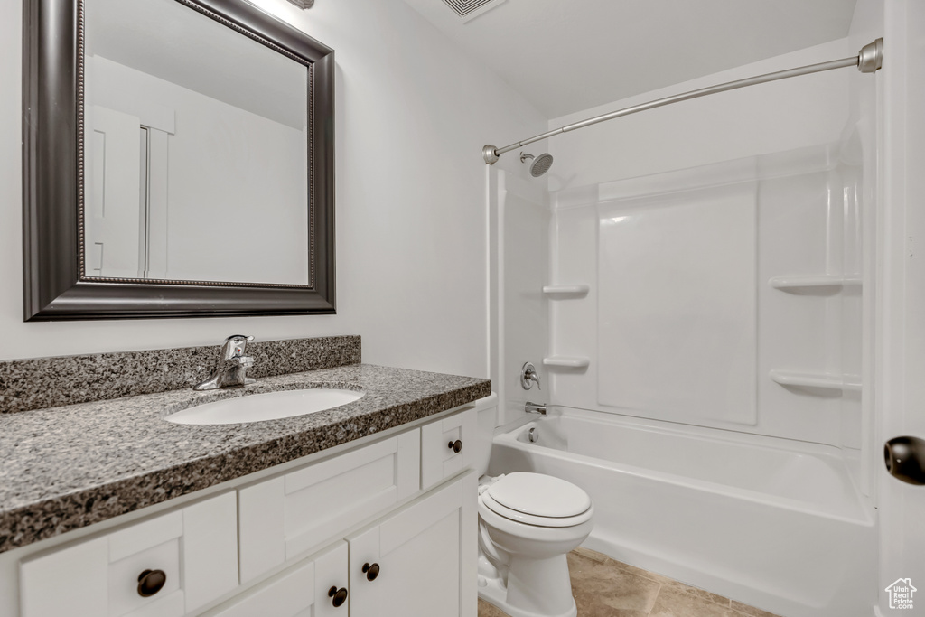 Full bath with vanity, tub / shower combination, and toilet