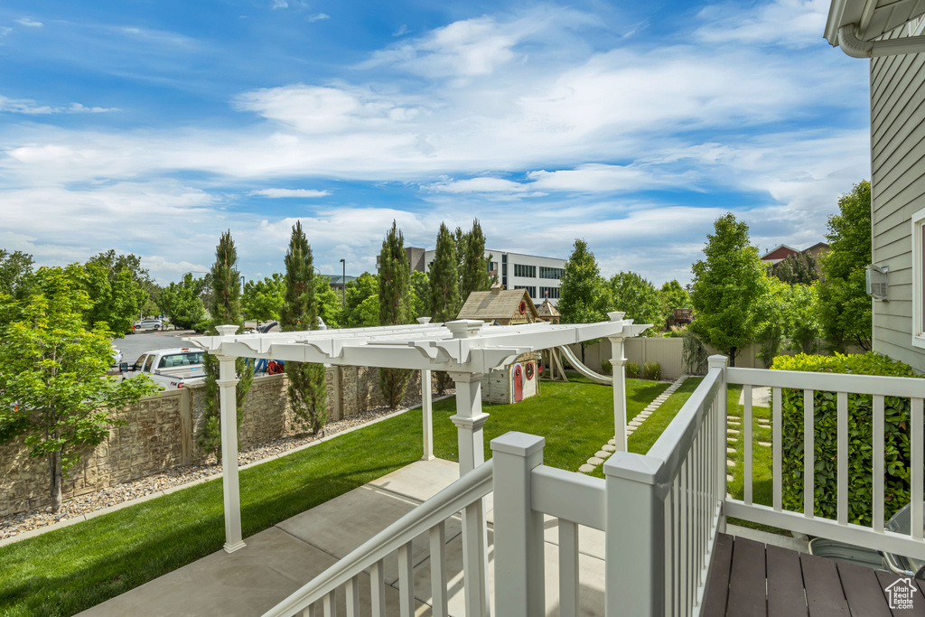 Wooden terrace featuring a pergola