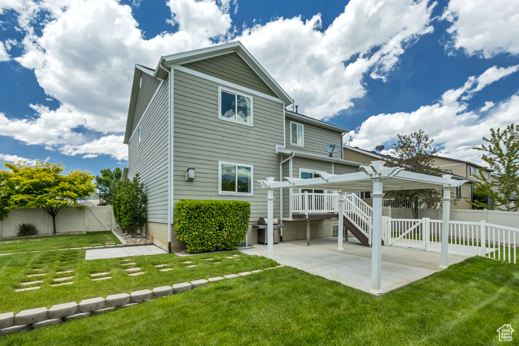Rear view of property with a patio area