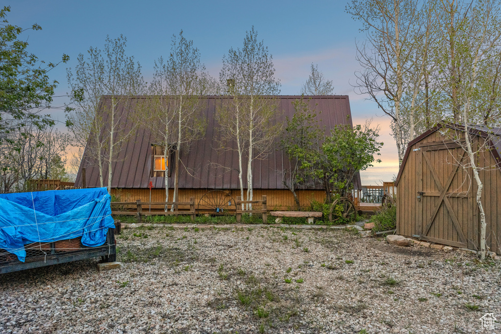 View of yard at dusk