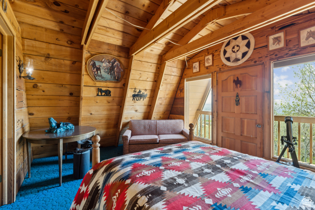 Bedroom featuring carpet flooring, wood walls, and wood ceiling