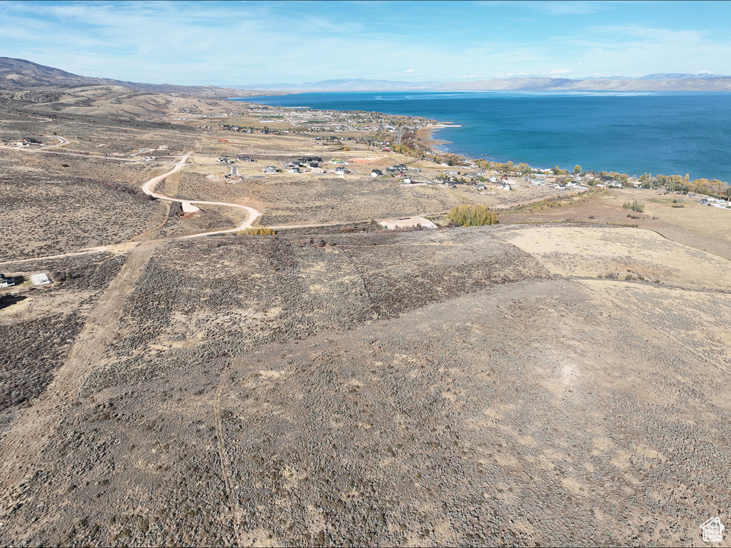 View of property location with a water and mountain view