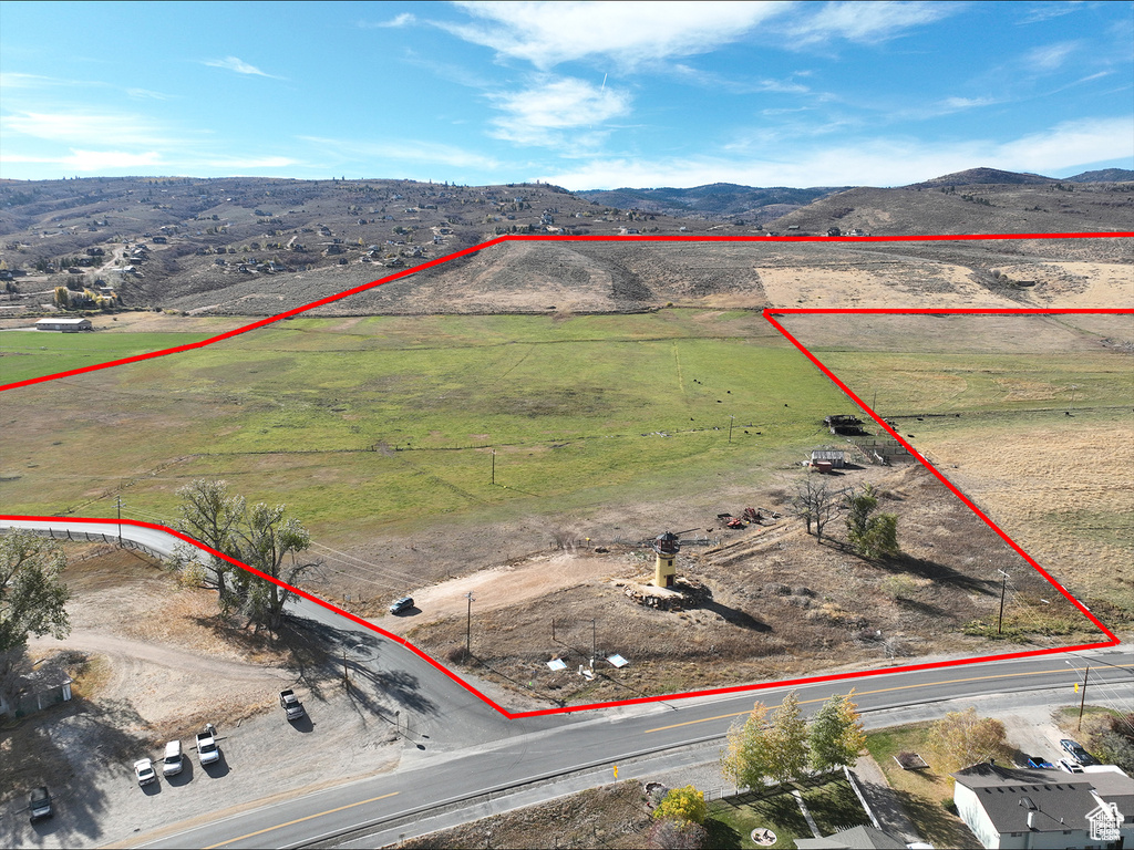 View of rural area with property parcel outlined and mountains