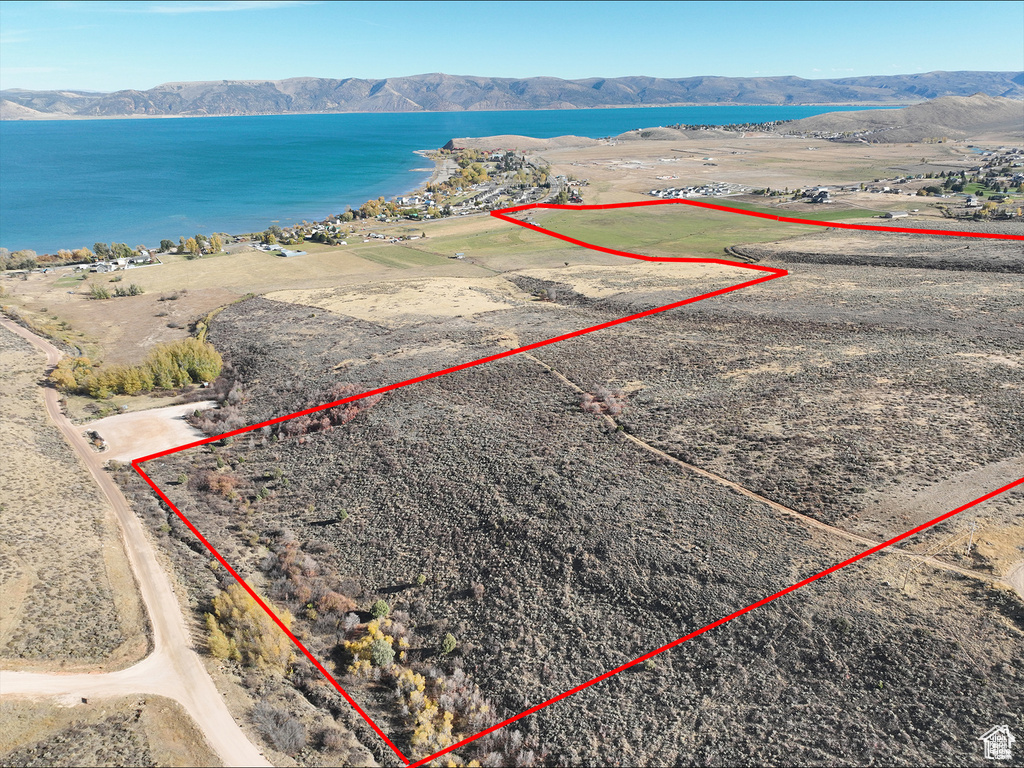 View of property location featuring property parcel outlined and a water and mountain view